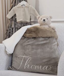 Brown Velvet Personalised Sack displayed with selection of toys and accessories.