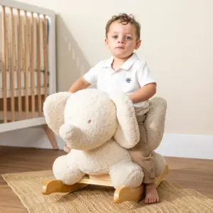 toddler playing on Nattou Teddy Elephant Rocker in ecru