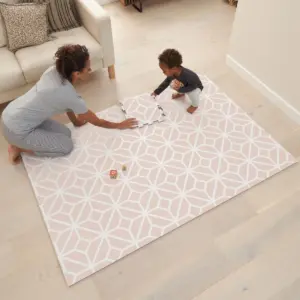 woman and toddler playing on the Tutti Bambini puzzle playmat - tiles blush rose