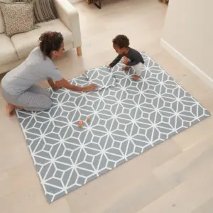 woman and toddler playing on the Tutti Bambini Puzzle Playmat in Tiles Grey