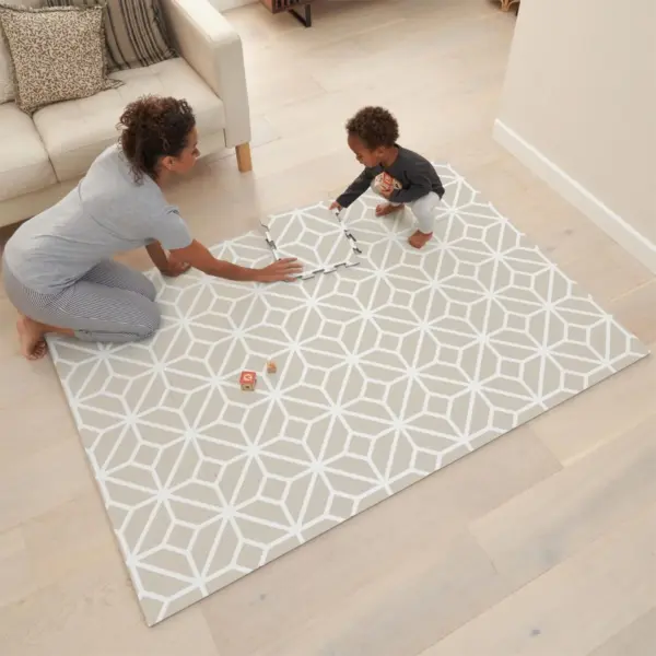 woman and toddle playing on the Tutti Bambini puzzle play mat - tiles white sand