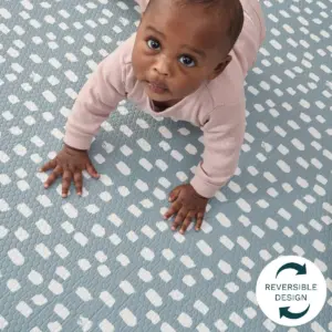 Baby crawling on Tutti Bambini Padded XL Reversible Play Mat in Cathedral & Dash