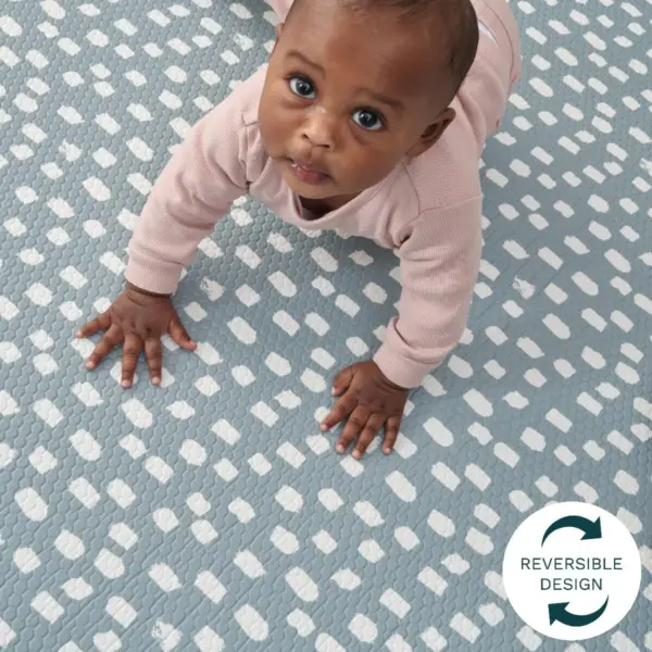 Baby crawling on Tutti Bambini Padded XL Reversible Play Mat in Cathedral & Dash