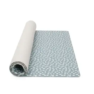 Tutti Bambini XL Reversible Playmat in Cathedral & Dash rolled for storing