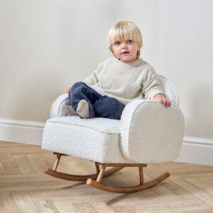 young child sitting on the tutti bambini micah mini me children's rocking chair in fresh cream