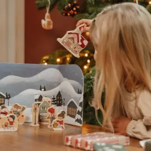 young girl playing with the Little Dutch Advent Calendar